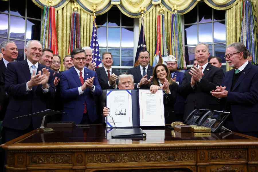 US President Donald Trump poses for a photo with senate members after signing the funding bill to end the U.S. government shutdown, at the White House in Washington, D.C., US, November 12, 2025.