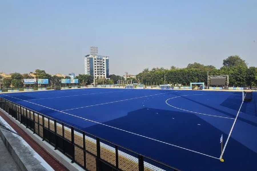 A view of the flood-lit astroturf stadium.