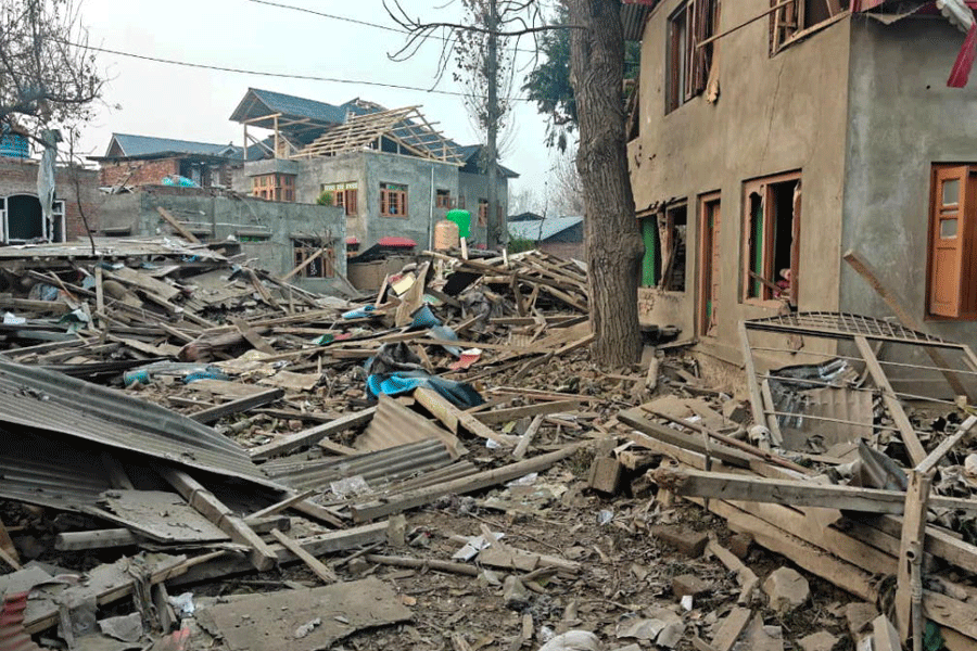 Debris at the site after the house of Dr Umar Nabi, who drove the explosive-laden car involved in the Delhi blast, was demolished by security forces, in Jammu and Kashmir's Pulwama district.