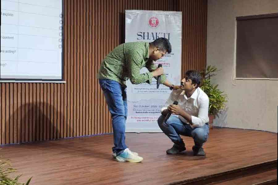 A policeman and a civic volunteer enact an imagined situation of the police taking care of a pedestrian after an accident at a workshop by Monoshij for police personnel . Picture by Sudeshna Banerjee