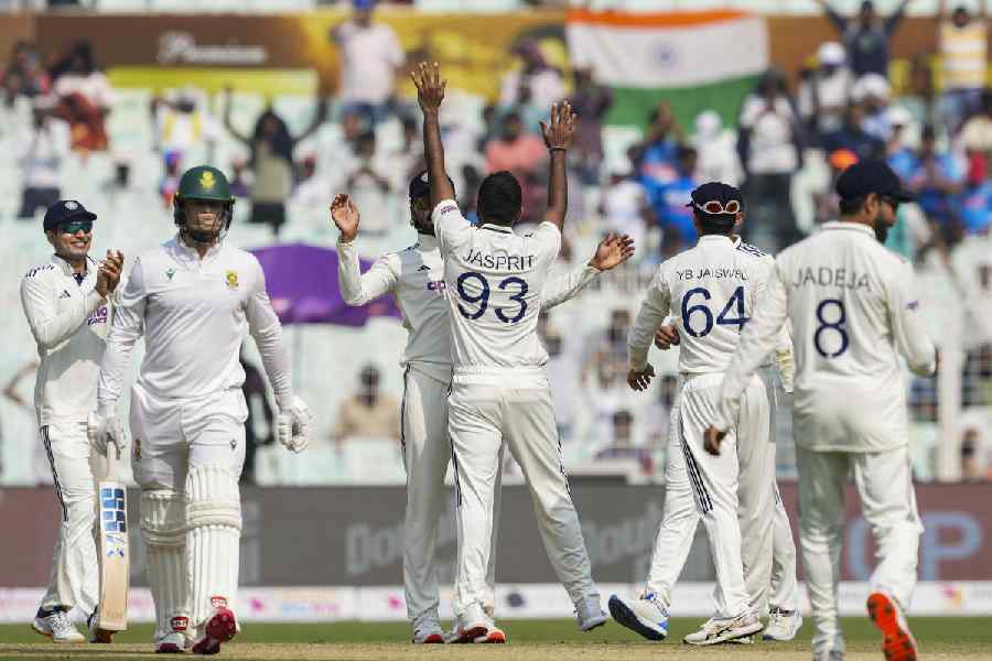 India's Jasprit Bumrah celebrates with teammates after taking the wicket of South Africa's Ryan Rickelton during the first day of the first Test cricket match between India and South Africa, at the Eden Gardens, in Kolkata, Friday, Nov. 14, 2025.