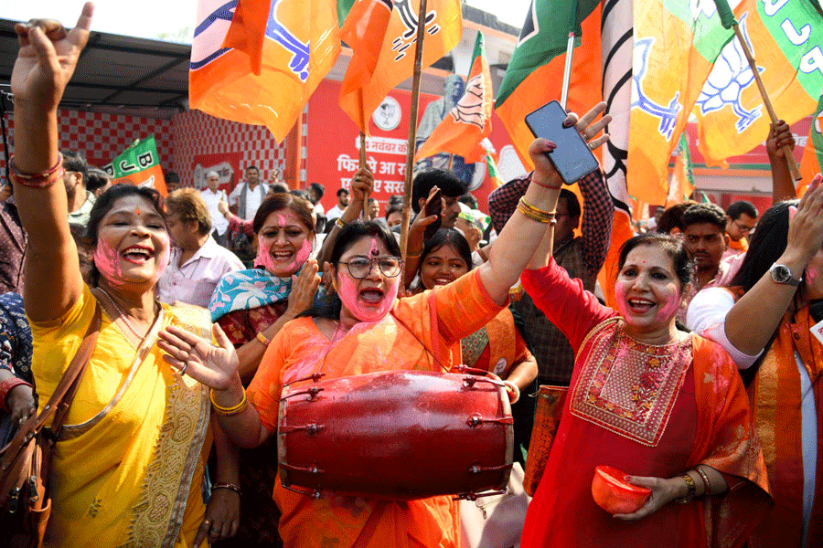 Bharatiya Janata Party (BJP) supporters celebrate as early trends show the ruling National Democratic Alliance leading in the Bihar state assembly election results, in Patna, India, November 14, 2025.