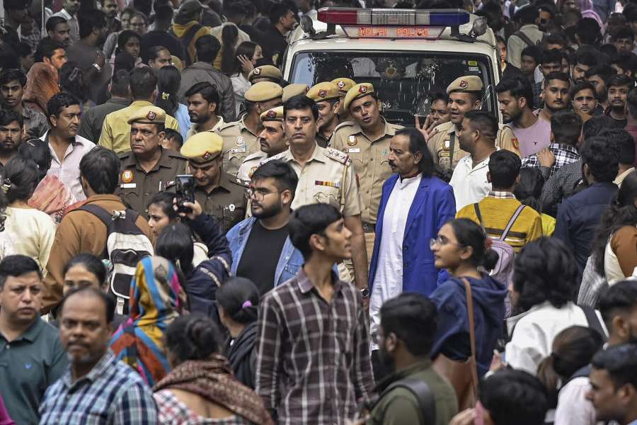 Police personnel conduct a flag march amid heavy rush of people, in the aftermath of the Red Fort blast, at Sarojini Nagar market, in New Delhi, Thursday, Nov. 13, 2025.