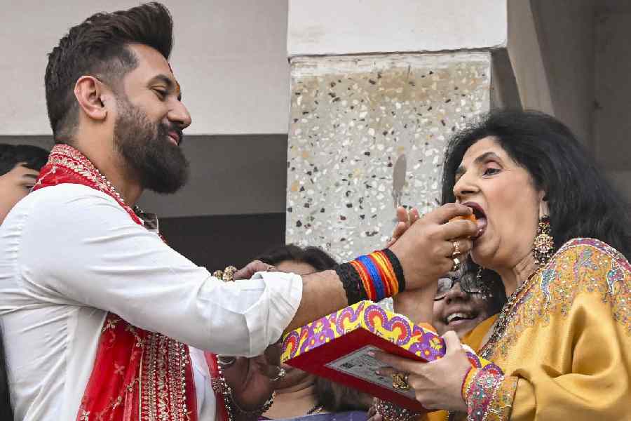 Union Minister and Lok Janshakti Party (Ram Vilas) chief Chirag Paswan offers sweets to his mother Reena Paswan during celebrations after NDA's victory in Bihar Assembly elections, in Patna.