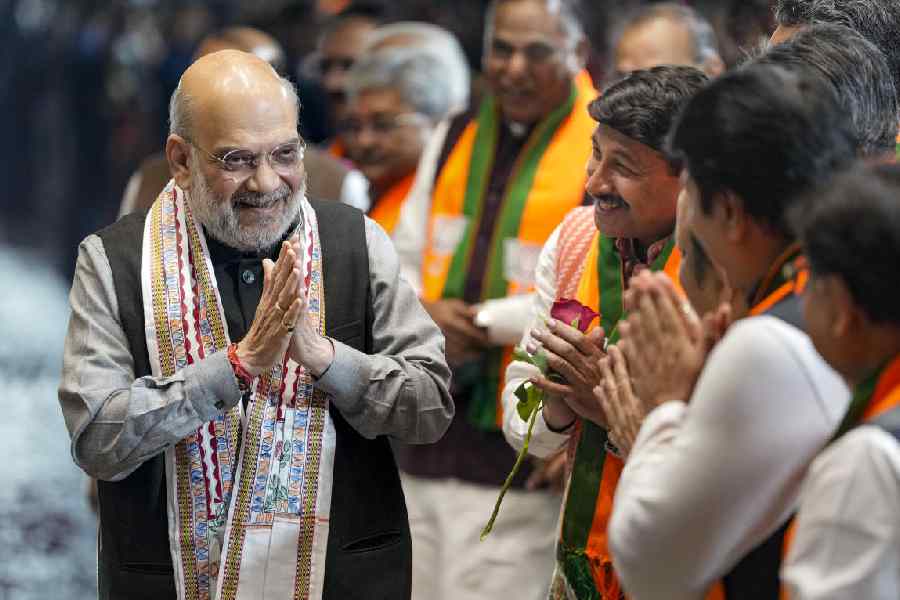 Union Home Minister Amit Shah being greeted by BJP MP Manoj Tiwari and others upon his arrival during the celebration of NDA’s victory in the Bihar Assembly elections, at BJP headquarters, in New Delhi.