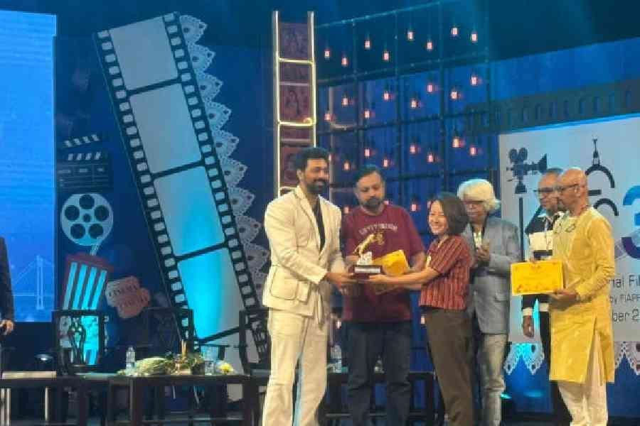 Tribeny Rai receives the Hiralal Sen Memorial Award for the best Indian language film at the 31st Kolkata International Film Festival on Thursday