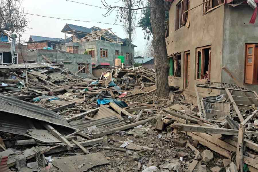 Debris at the site of Umar's house that was demolished by security forces in Pulwama on Friday.