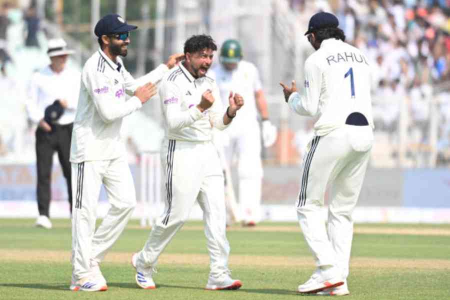 Kuldeep Yadav takes the wicket of South Africa captain Temba Bavuma, with Jurel taking the catch, during the first day of the South Africa–India Test match at Eden Gardens on Friday