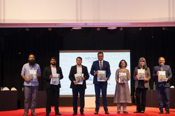 The team from Shiv Nadar University, Delhi-NCR and other dignitaries unveil the brochure of Shiv Nadar’s new IHS programme at Tollygunge Club