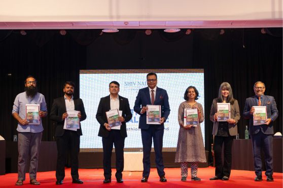 The team from Shiv Nadar University, Delhi-NCR and other dignitaries unveil the brochure of Shiv Nadar’s new IHS programme at Tollygunge Club
