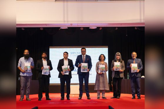 The team from Shiv Nadar University, Delhi-NCR and other dignitaries unveil the brochure of Shiv Nadar’s new IHS programme at Tollygunge Club