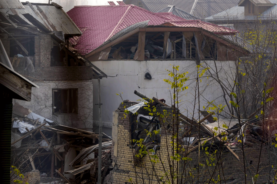 Part of the Nowgam police station, front, partially damaged in a blast as seen from the window of a nearby house, in Srinagar, Jammu and Kashmir, Saturday, Nov. 15, 2025.