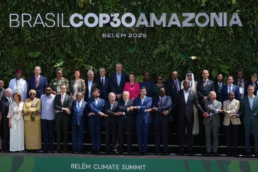 Leaders attending the COP30 U.N. Climate Summit pose for a group photo in Belem, Brazil, Friday, Nov. 7, 2025.