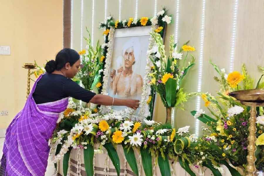 Forest minister and Trinamool’s ST cell president Birbaha Hansda offers floral tribute to Birsa Munda at Nabanna on Saturday