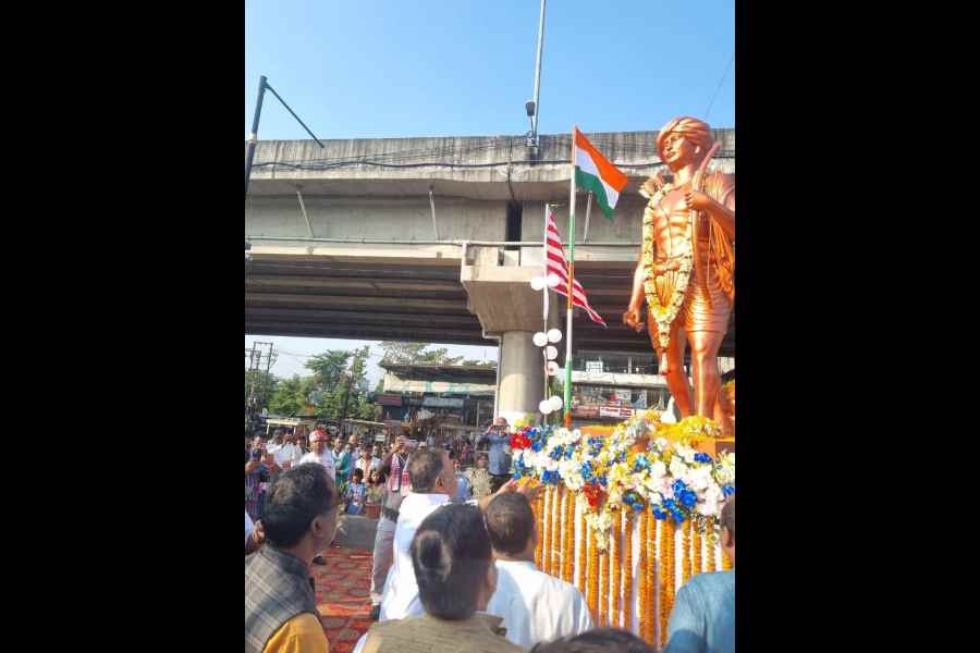 BJP state president Samik Bhattacharya offers floral tribute to a statue of Birsa Munda at Patharghata near Siliguri on Saturday