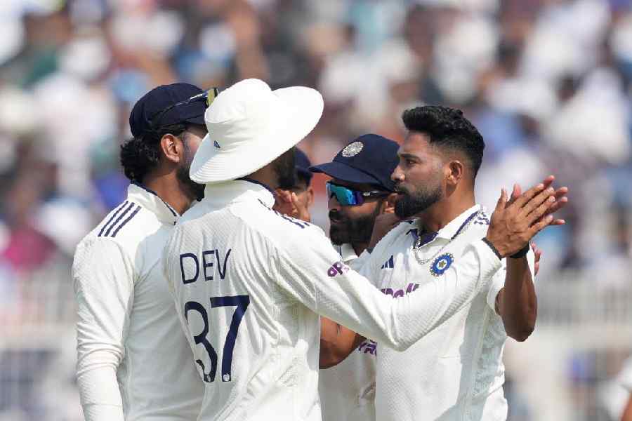 India's Mohammed Siraj with teammates after the wicket of South Africa's Simon Harmer during the third day of the first Test cricket match of a series between India and South Africa, at Eden Gardens in Kolkata, Sunday, Nov. 16, 2025.