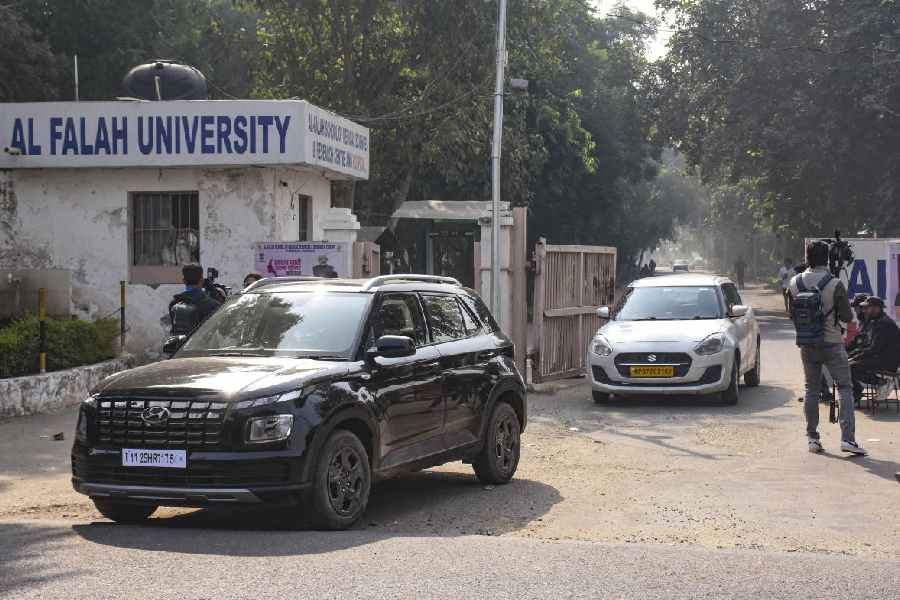 Vehicles exit the Al-Falah University amid investigation in the aftermath of a blast near the Red Fort, in Faridabad, Haryana, Wednesday, Nov. 12, 2025. Dr Umar Nabi, an assistant professor at the university, is said to have been driving the car that exploded on Monday, according to officials