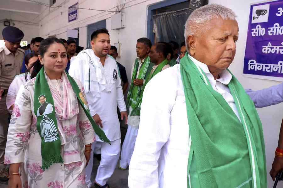 RJD chief Lalu Prasad Yadav with daughter Rohini Acharya and son Tejashwi Yadav during an event, in Saran district.