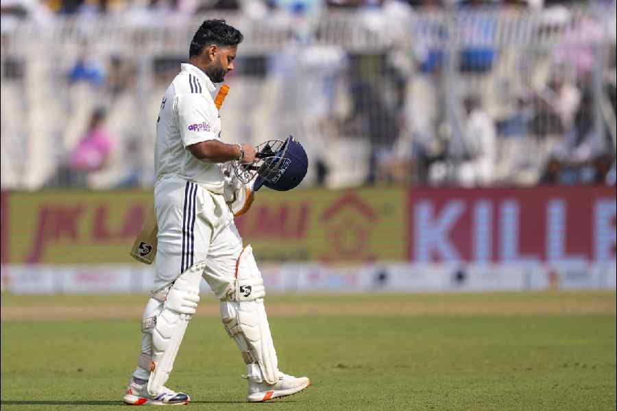 Rishabh Pant walks off the field after his dismissal during the second day of the first Test cricket match of a series between India and South Africa, at the Eden Gardens, in Kolkata, Saturday, Nov. 15, 2025.