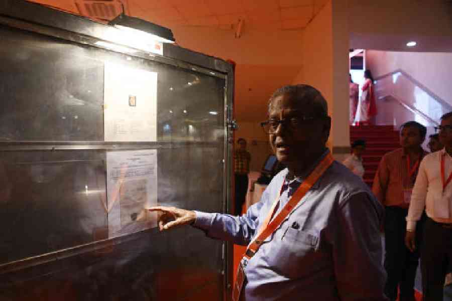 S.C. Sukhani shows his exhibits displayed in the invitee class at the state-level philately exhibition Bongopex at Science City on Friday. Pictures by Bishwarup Dutta