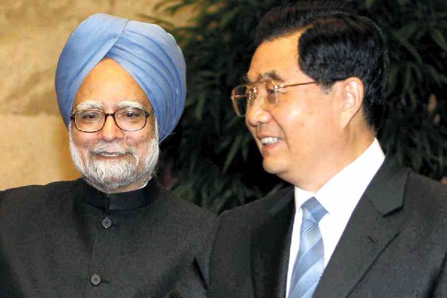 In this Oct. 25, 2008 file photo, then Prime Minister Manmohan Singh with then President of China Hu Jintao, in Beijing, China.