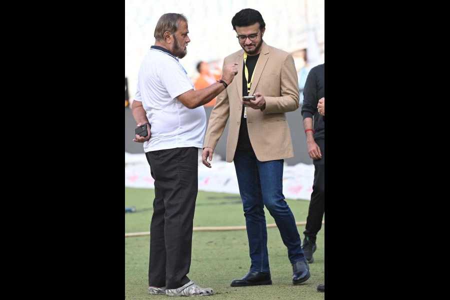 Eden Gardens curator Sujan Mukherjee discusses a point with CAB president Sourav Ganguly on Sunday. Picture by Sanat Kumar Sinha