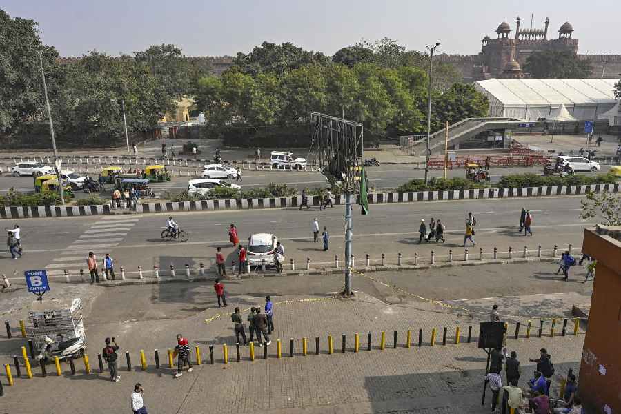 Commuters near the Red Fort days after a car blast in the area, in New Delhi, Saturday, Nov. 15, 2025. Netaji Subhash Marg near the Red Fort was reopened on Saturday