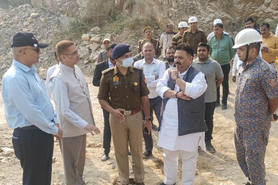 Uttar Pradesh minister Ravindra Jaiswal visits the site after a portion of a stone quarry collapsed, in Sonbhadra, UP, Monday, Nov. 17, 2025. At least six workers were killed in the incident.