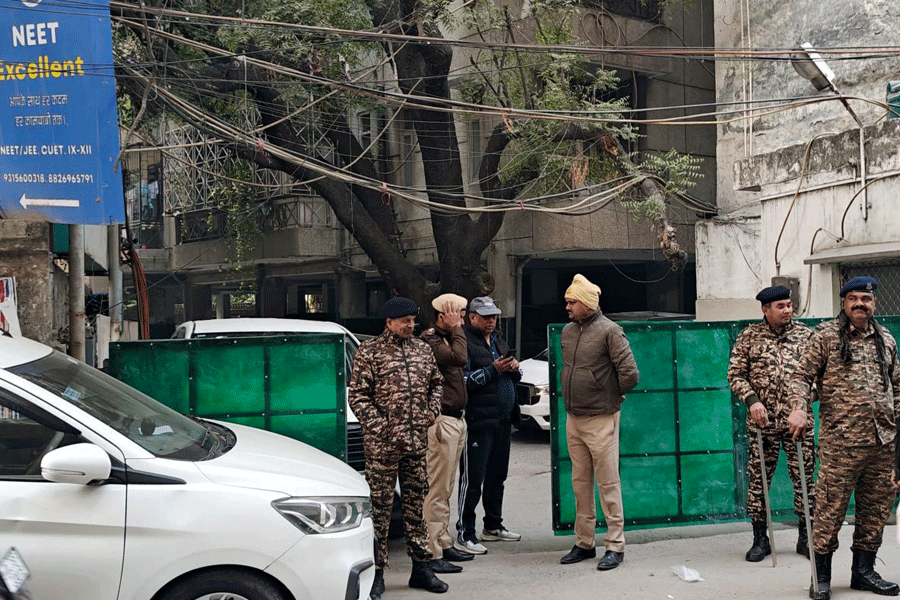Officials at the site after Enforcement Directorate (ED) conducts a raid at the Delhi office of Al Falah University in Okhla as part of an investigation into a terror module linked to Faridabad and the recent blast near the Red Fort, Tuesday, Nov. 18, 2025.