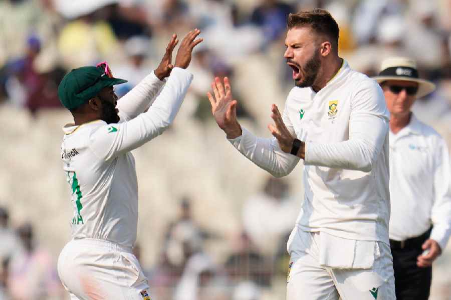 Captain Temba Bavuma celebrates with Aiden Markram (right) during South Africa’s 30-run win over India.