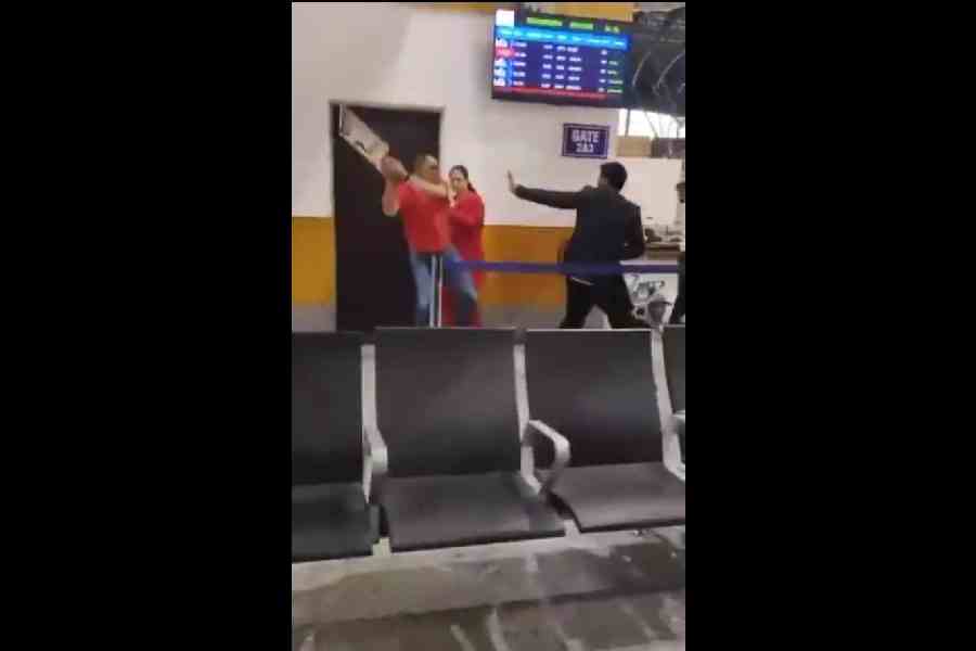 Video footage shows a man, believed to be Lt Col RK Singh, attacking an airline staffer with a queue stand at Srinagar airport.