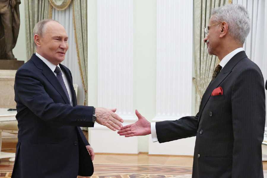 Russian President Vladimir Putin, left, and Indian Foreign Minister Subrahmanyam Jaishankar shake hands during their meeting at the Senate Palace of the Kremlin in Moscow, Russia