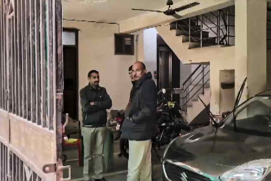 Officials during the ED raid on an Al Falah property in New Delhi on Tuesday.