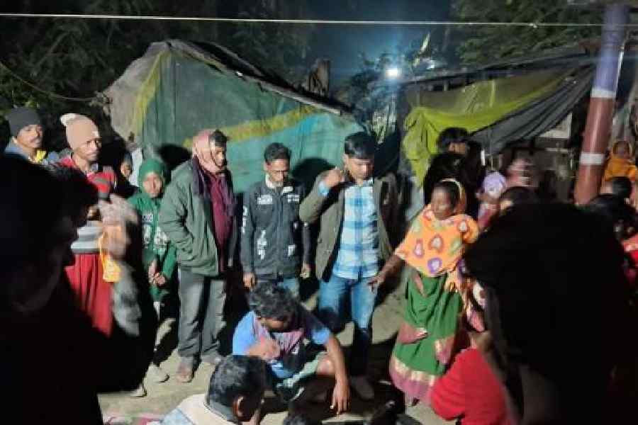 Villagers gathered In front of Sambhu Sardar’s house at Kantamari village in Kultali on Monday night