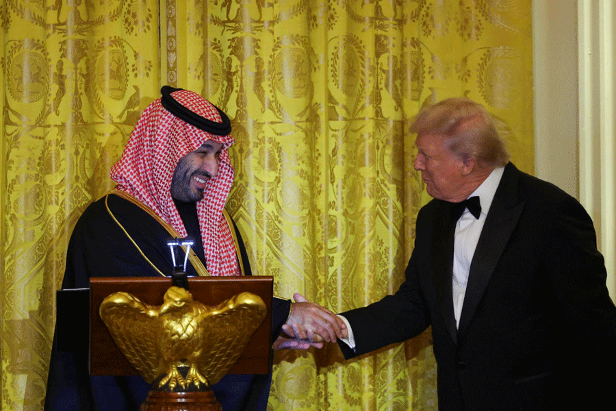 U.S. President Donald Trump greets Saudi Crown Prince and Prime Minister Mohammed bin Salman, during a dinner at the White House in Washington, D.C., U.S., November 18, 2025.