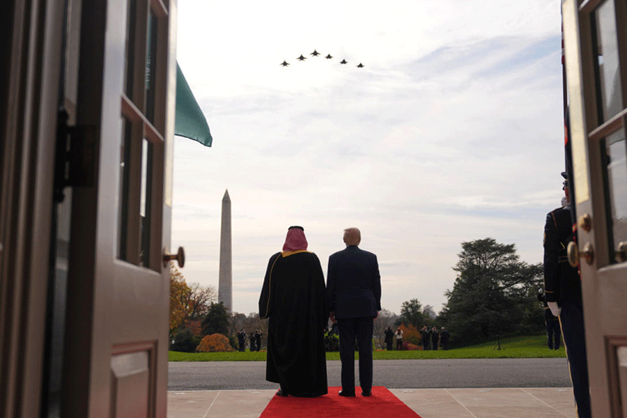 President Donald Trump and Saudi Arabia's Crown Prince Mohammed bin Salman watch a flight of F-35's during a welcome ceremony on the South Lawn of the White House, Tuesday, Nov. 18, 2025, in Washington.