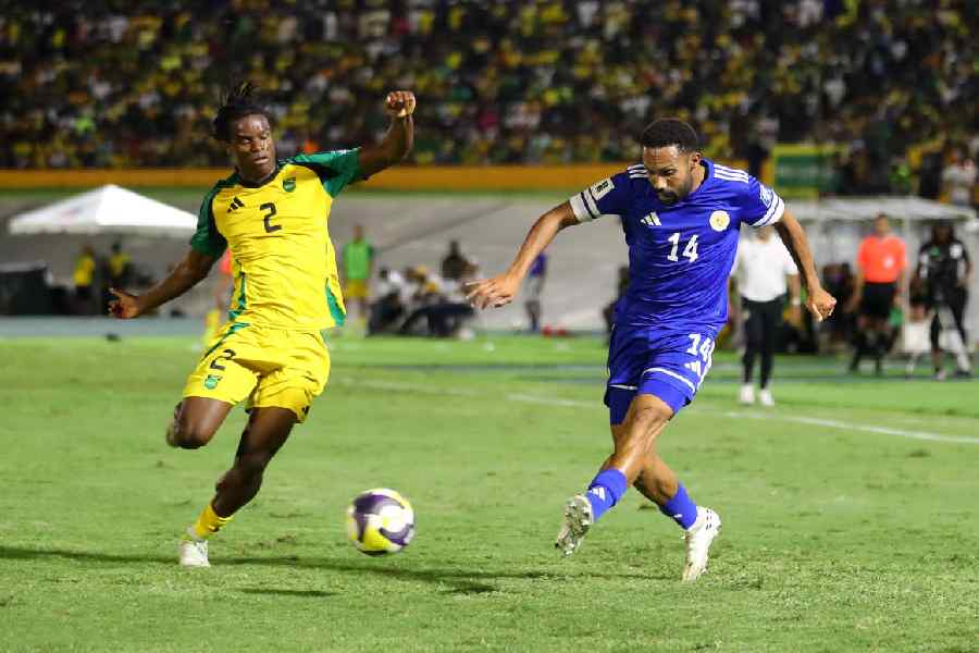 Curacao's Kenji Gorre in action with Jamaica's Dexter Lembikisa.