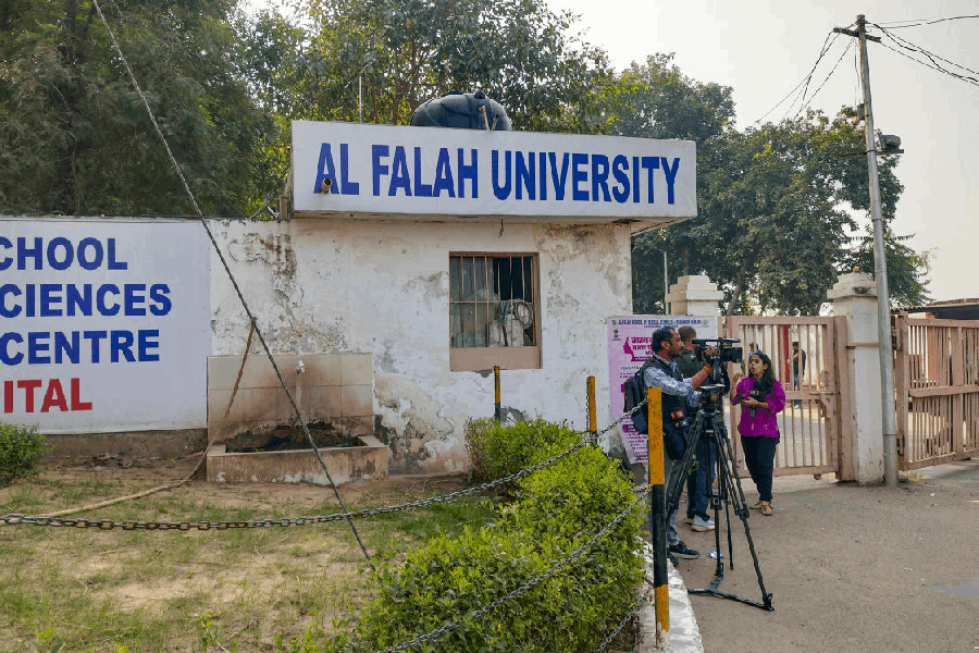 Media persons outside the Al Falah School of Medical Sciences and Research Centre, in Faridabad, Haryana, Tuesday, Nov. 18, 2025.