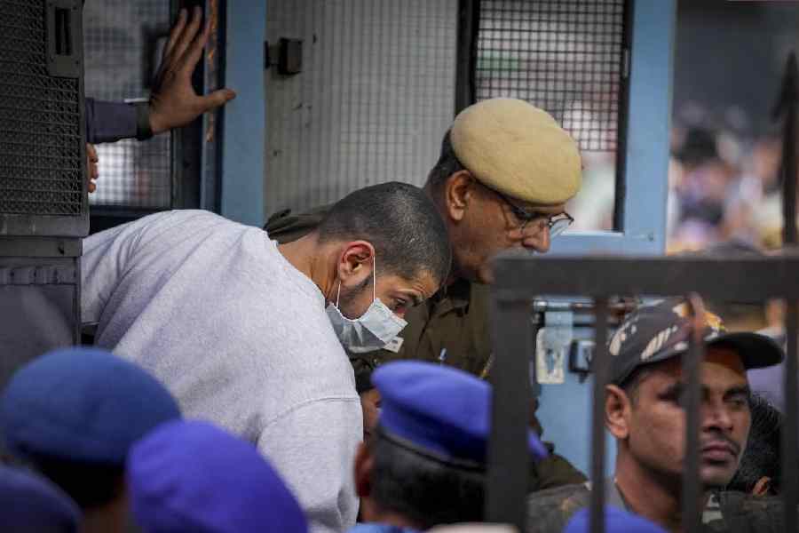 Anmol Bishnoi being brought to the Patiala House Court in New Delhi on Wednesday.