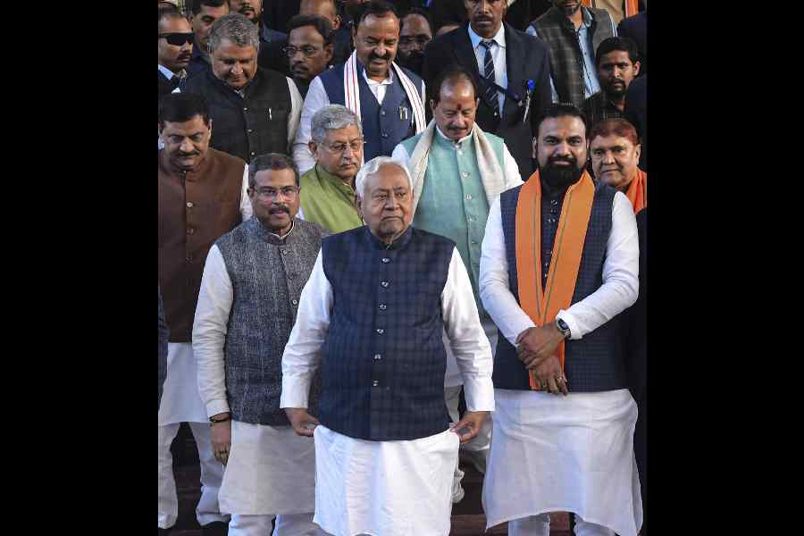 Nitish Kumar, flanked by Dharmendra Pradhan, Vijay Sinha and Samrat Choudhary, in Patna on Wednesday.