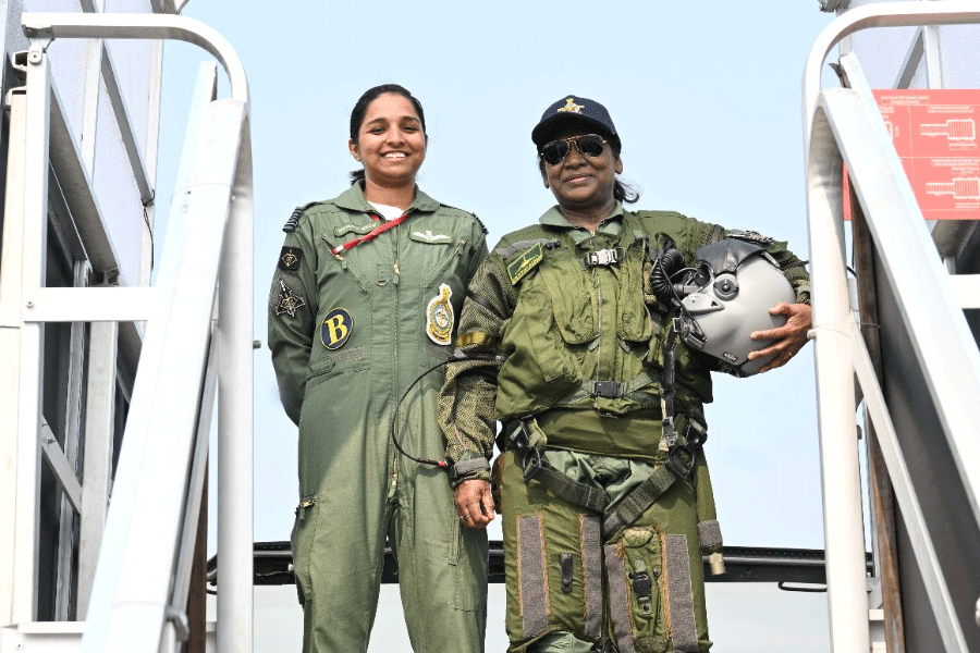 President Droupadi Murmu poses for pictures with Squadron Leader Shivangi Singh before she takes a sortie in Rafale fighter jet, at Air Force Station in Haryana's Ambala.
