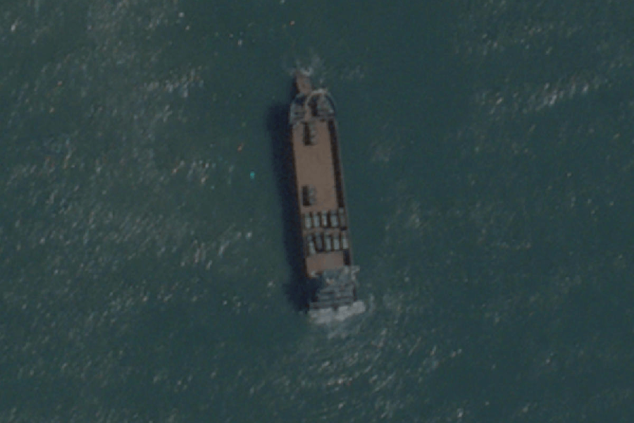 A satellite image taken by Planet Labs shows a deck cargo ship, loaded with vehicles, cruising towards the beach near Jiesheng, Guangdong, China July 16, 2025.