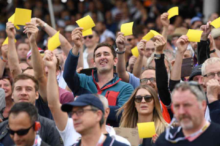England fans show off their yellow sandpaper to mock the Australian players during the Edgbaston Test in 2019.