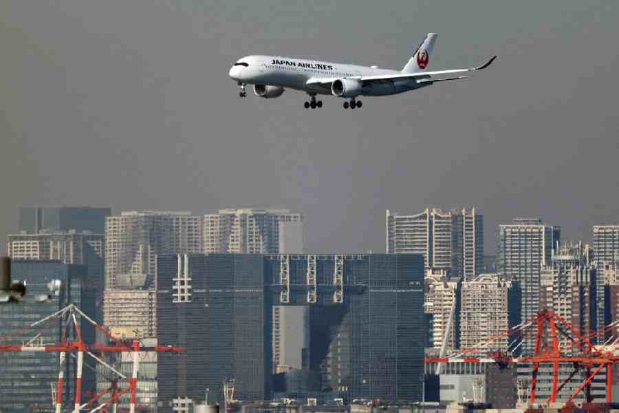An airplane of Japan Airlines (JAL) approaches to land at Haneda International Airport in Tokyo