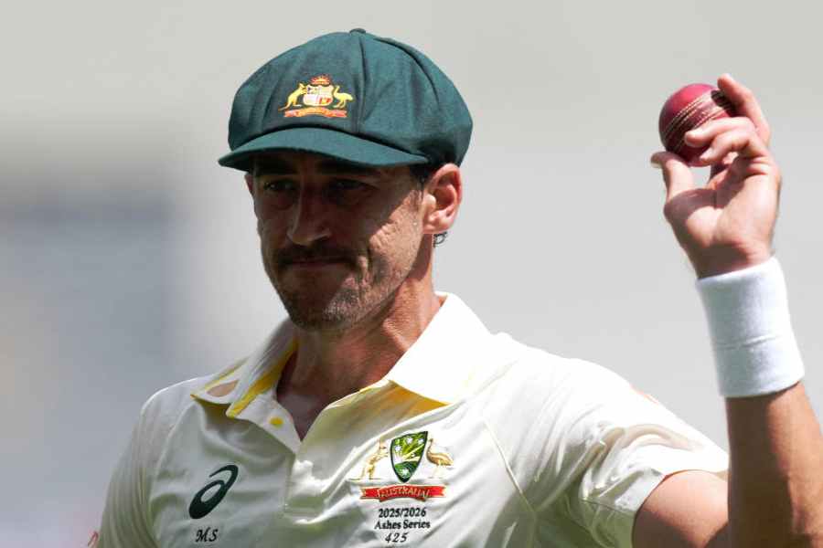 Cricket - The Ashes - Australia v England - First Test - Perth Stadium, Perth, Australia - November 21, 2025 Australia's Mitchell Starc acknowledges the crowd after his seven wicket haul following the wicket of England's Mark Wood to end the innings, caught out by Alex Carey