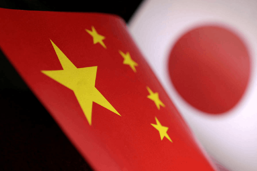 File photo: Printed Chinese and Japanese flags are seen in this illustration.