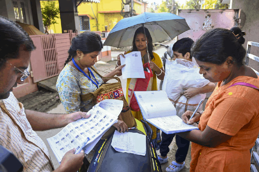 Booth Level Officers on field to distribute enumeration forms to voters as the Special Intensive Revision (SIR) of election rolls begins in West Bengal, at Balurghat in Dakshin Dinajpur district.