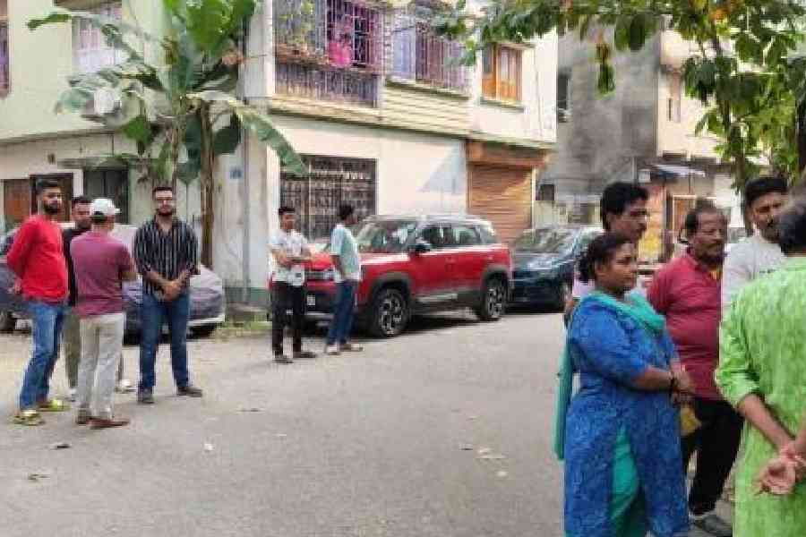 Residents of Northern Park in Baranagar gather after pellet shots were fired at a man in the locality on Friday morning
