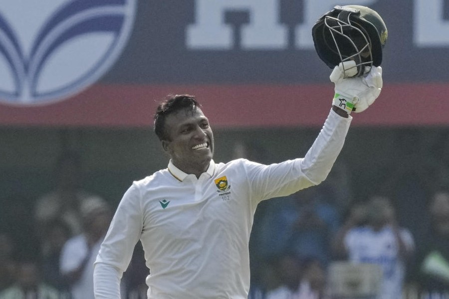 South Africa's Senuran Muthusamy celebrates his century during the day two of the second Test cricket match of a series between India and South Africa, at ACA Stadium in Guwahati, Sunday, Nov. 23, 2025.