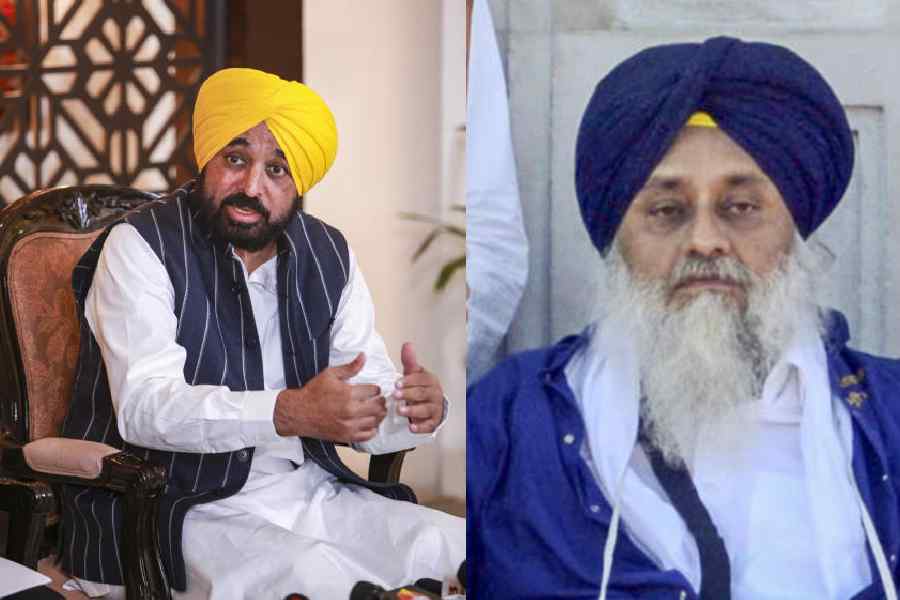 Bhagwant Singh Mann and (right) Sukhbir Singh Badal